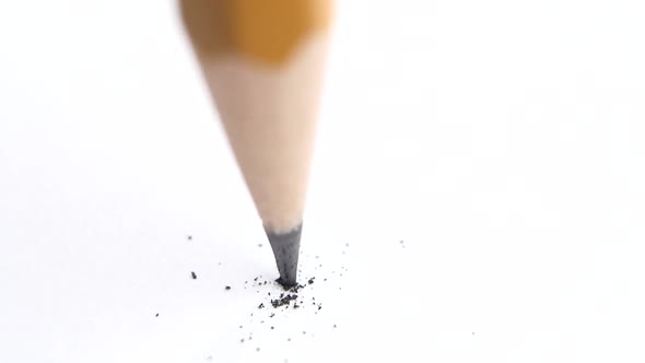 Broken Head of Sharp Pencil on a White, Slow Motion