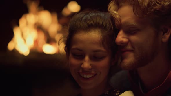 Cheerful Couple Enjoy Cuddle Fireplace Closeup