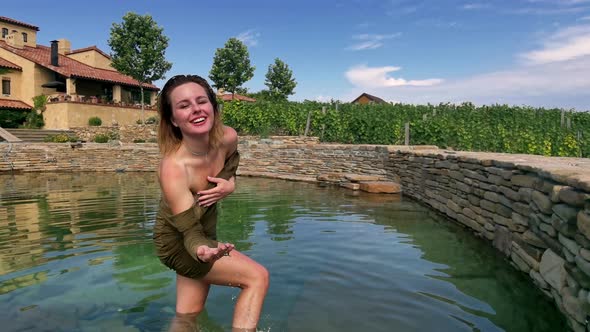 Woman Relaxing the Countryside in Natural Swimming Pool From Stone  Tuscany Italy