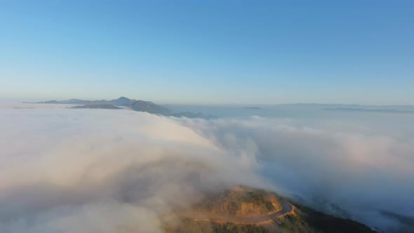 Mountain landscape in clouds, bend of the road in Malibu Canyon, Monte Nido, California, USA