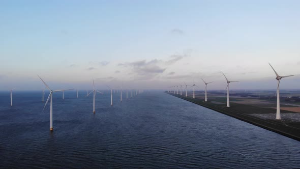 Offshore Windmill Park with Clouds and a Blue Sky Windmill Park in the Ocean Drone Aerial View with