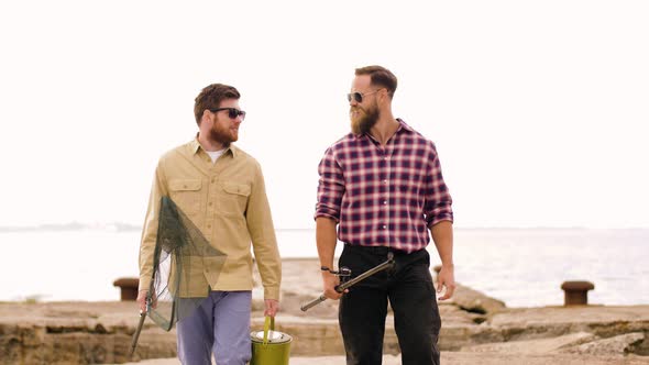 Happy Friends with Fishing Rods Walking Along Pier 18