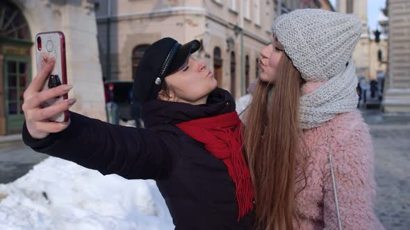 Two Young Smiling Women Tourists Bloggers Taking Selfie Photos Portrait Video Conferencing Call