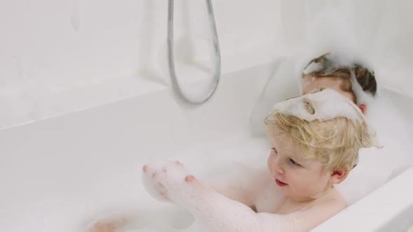 Baby Boy Amazed By Soap Suds