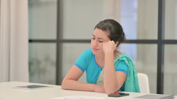 Sleepy Indian Woman Taking Nap While Sitting in Office