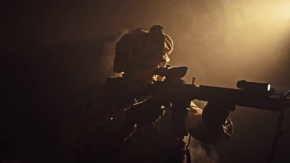 Soldiers Taking Aim From Rifle in the Dark Smoke in Background Military and Army Concept