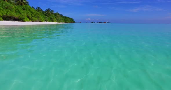 Beautiful birds eye travel shot of a white paradise beach and blue ocean background in best quality 