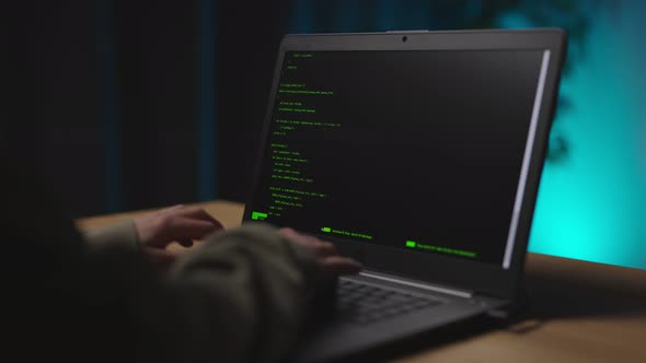 Woman Using Laptop for Coding