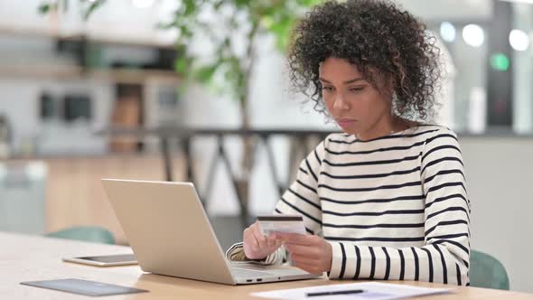 Online Shopping By African Woman on Laptop in Office