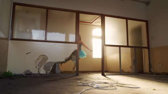 Female dancer in an empty warehouse