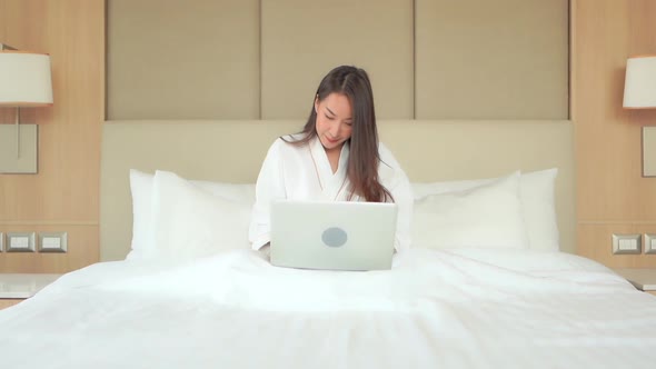 Young asian woman use laptop