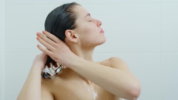 Young Woman Taking Refreshing Shower at Home