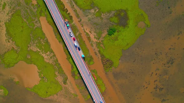 Drone video of the road leads through a large beautiful wetland.