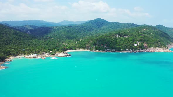 Rocky forested shore between two sandy beaches, Haad Thong Reng and Haad Than Sadet, Thailand