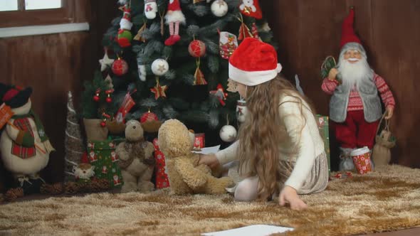 Girl Playing with a Teddy Bear