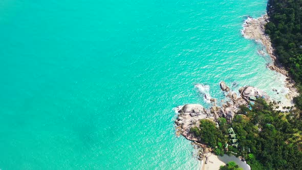 Pristine nature and turquoise water of the lagoon on Koh Phangan. Aerial panorama