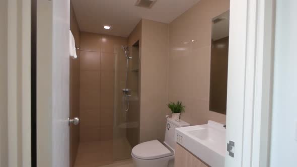 Small White Bathroom in an Apartment/ Hotel Room