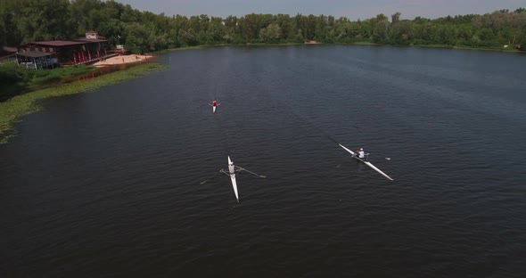 Sports Canoe Driven By Team Men Women Sailing Along Calm River with Sun