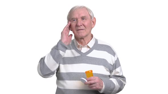 Senior Man Holding Medicine, White Background.