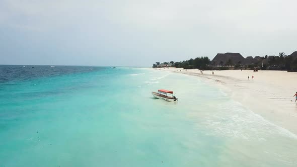 Flight Over Azure Ocean With Sailing Boat Swing On Waves