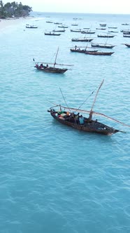 Boat Boats in the Ocean Near the Coast of Zanzibar Tanzania Slow Motion Vertical Video