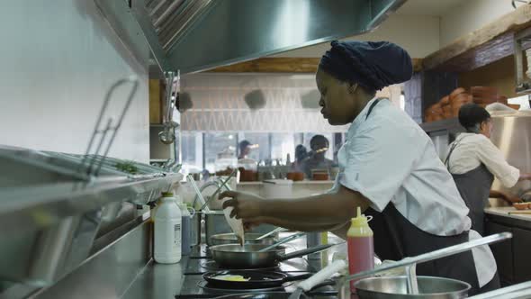 Mixed race woman cooking