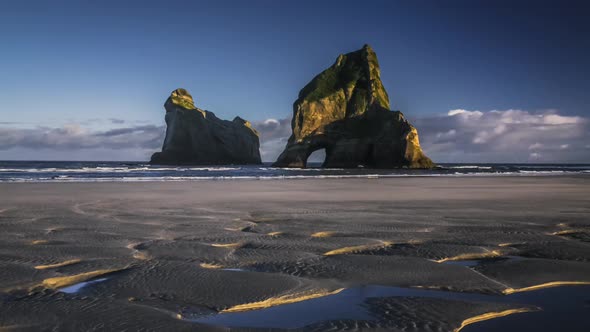 Archway on empty beach