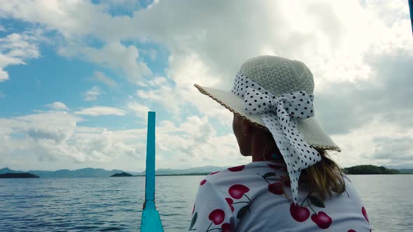 Girl in a Hat on a Boat