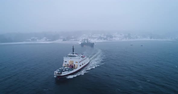 A ferry slowly picking up speed for cruising across the water