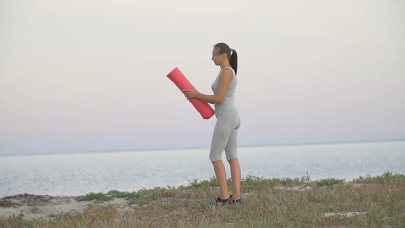 Girl Is Training on the Beach