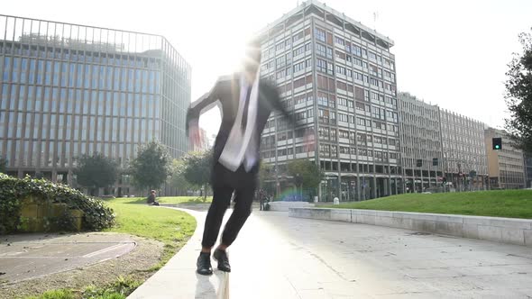 Slow motion young smart casual bearded man jumping outdoor