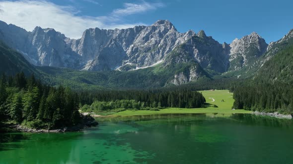 Emerald lake at Fusine with Mangart mountain