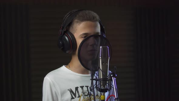 Boy Singing in Studio