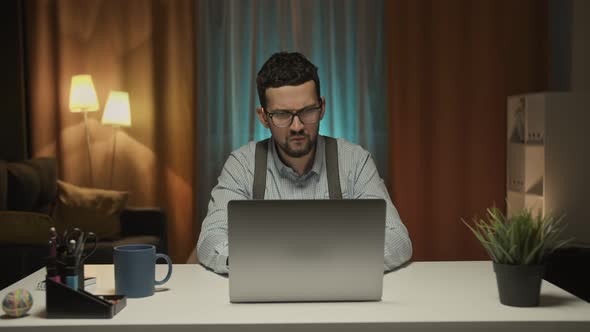 Stressed Businessman Designer in the Office Thumbs Down Failure