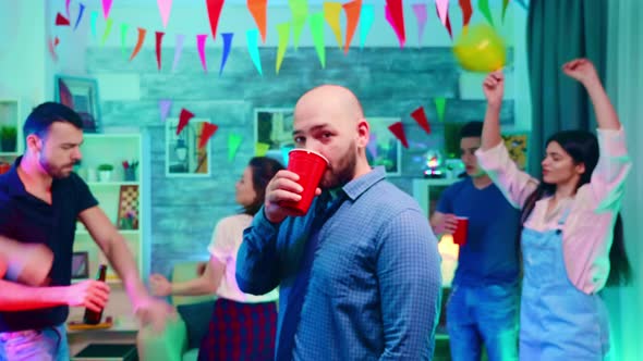 Zoom in Shot of Young Man Drinking Alcohol