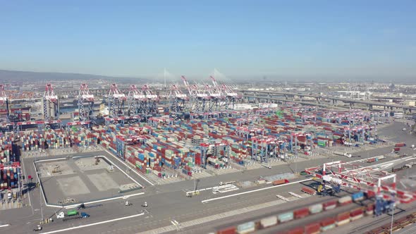 Cargo containers in busy port, aerial. Drone shot. 