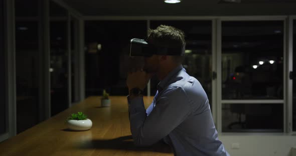 Businessman using VR helmet in a modern office