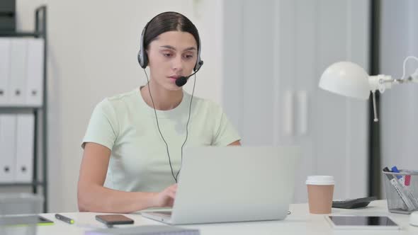 Call Center Woman Looking at Camera at Work