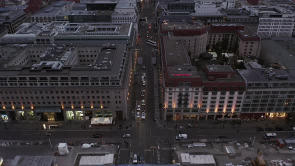 AERIAL: Beautiful View Over Berlin Mitte Office Buildings and Car Traffic City Lights on Cloudy Day