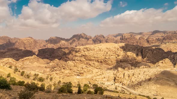 Rocky Sandstone Mountains with Clouds Sky in Jordan Desert Near Petra Ancient Town Jordan