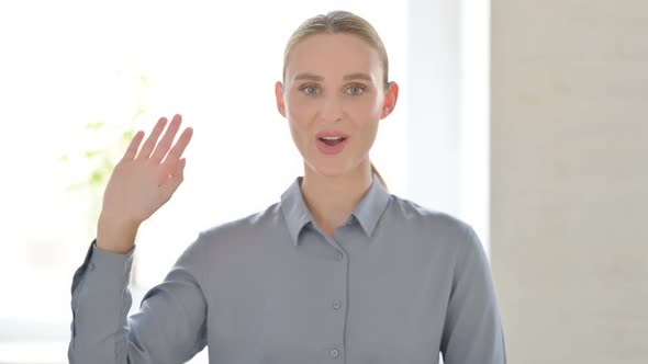 Portrait of Woman Waving Welcoming