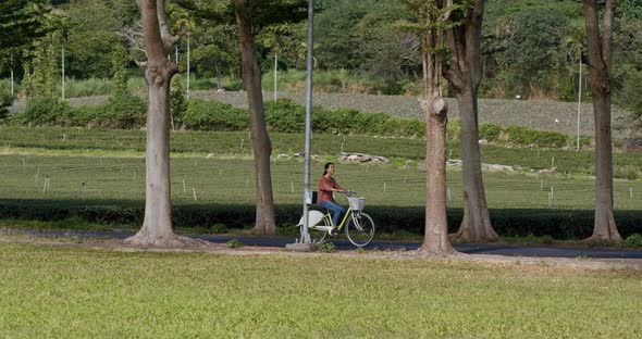 Woman ride a bike in countryside