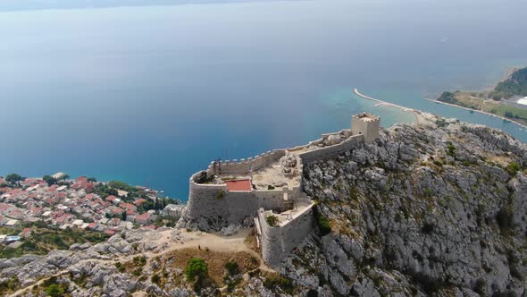 Aerial view of Starigrad Fortress (Fortica) on the hill over Omis town, Croatia