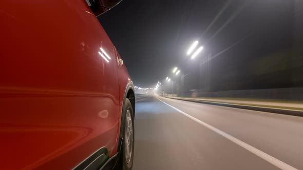 Drivelapse Urban Look From Fast Driving Car at a Night Avenue in a City Timelapse Hyperlapse