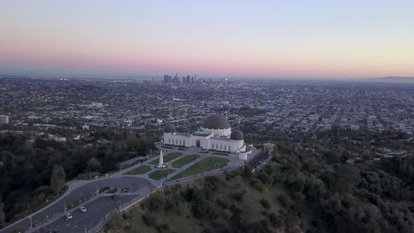 Griffith Observatory and the Los Angeles city skyline seen in the distance from above.