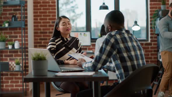 Male Recruiter Interviewing Job Seeker About Work Experience