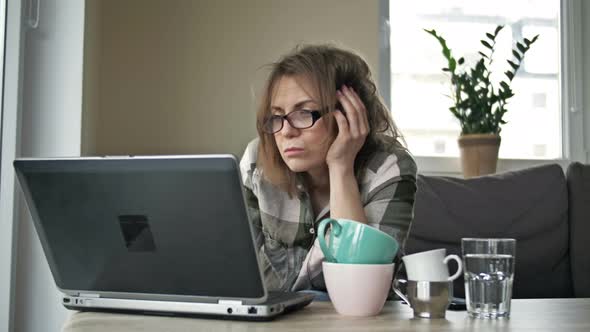 Very Tired Business Woman Working with Laptop at Home