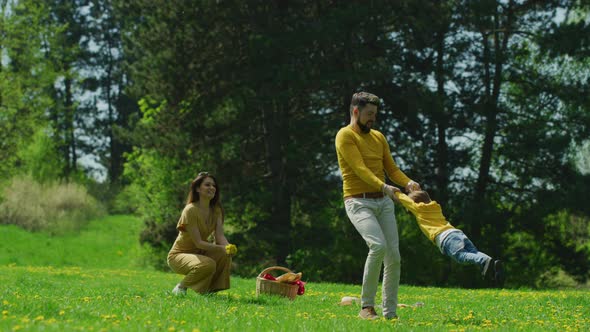 Father spinning his son