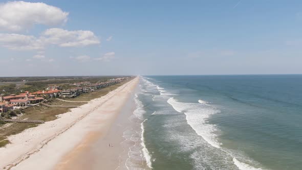 Beach shore of Ponte Vedra Beach showing waves crashing and the beach along the shore line in Florid