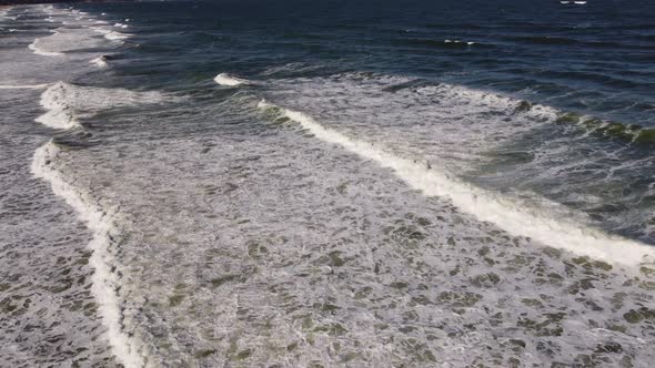 Aerial View of Sandy Beach and Sea Waves